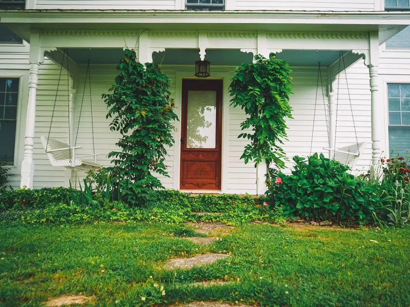 HVAC technician greeted at the front door of a Raleigh home