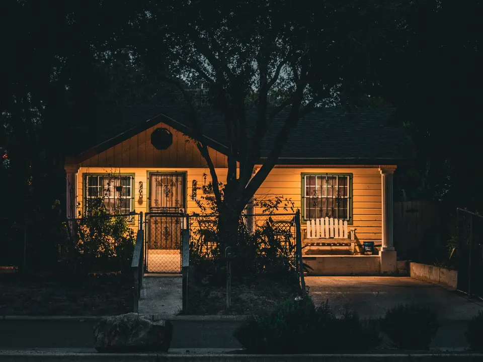 HVAC technician arriving at a Raleigh home in the evening