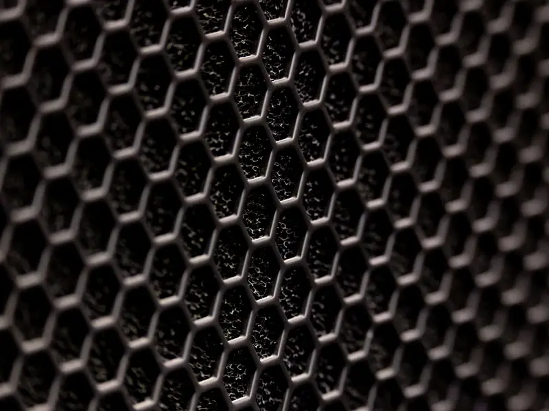 Homeowner removing a dirty air filter coated with pollen