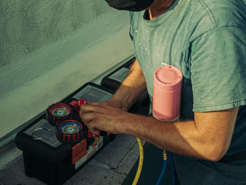 Technician completing a fall heating tune-up