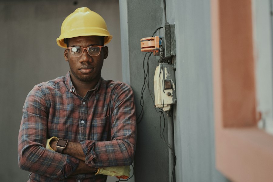 Portrait of an HVAC technician in hard hat on a job site