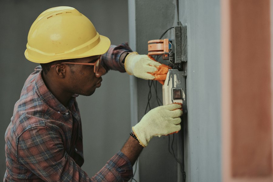 HVAC technician adjusting controls on equipment during a service call