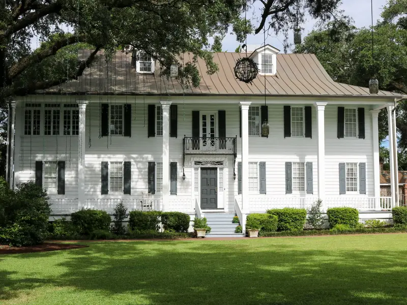 Older home with a magnolia tree in Wake Forest