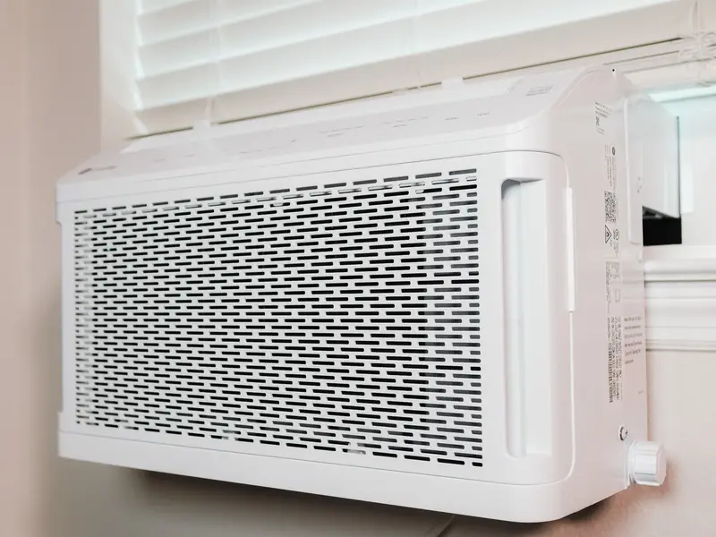 Indoor wall-mounted air unit under a window